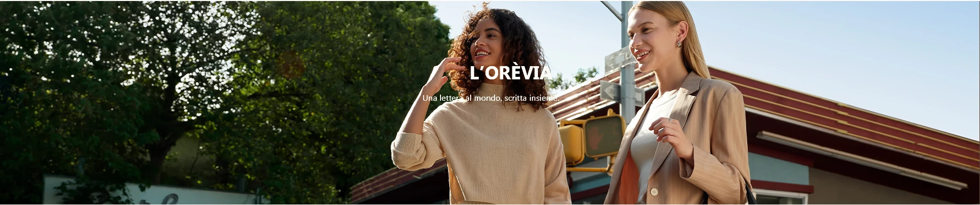 Two women walking outdoors with L’Orèvia styling